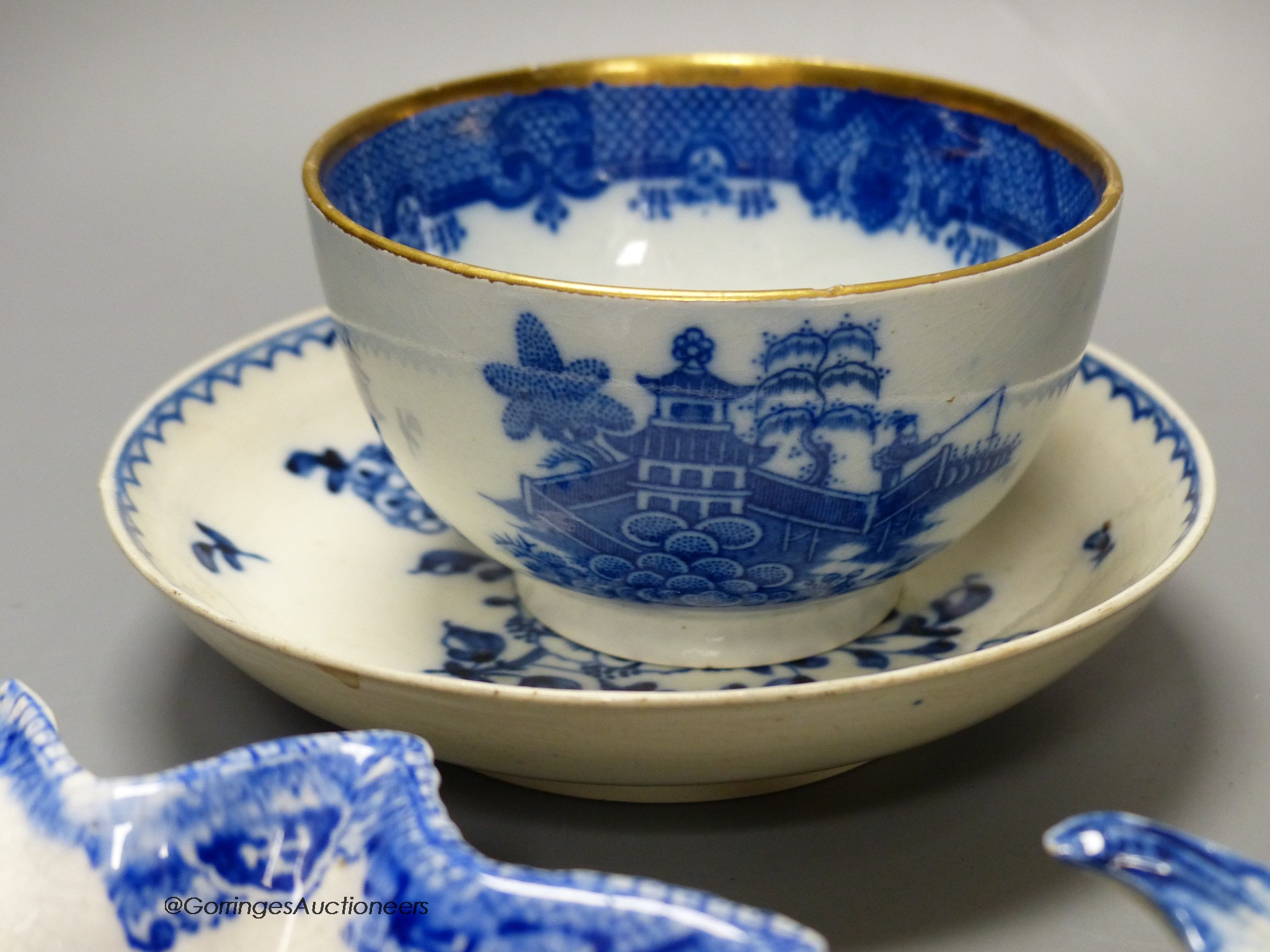 A 19th century Wedgwood blue jasper dish in classical style, five leaf dishes, a blue painted creamware saucer and a blue printed teabowl